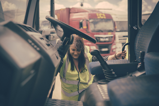 Hands on the wheel of a HGV lorry during training in Devon